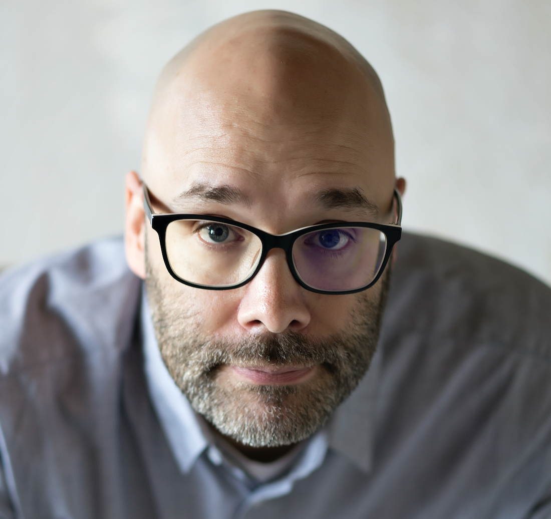 headshot of a guy wearing glasses