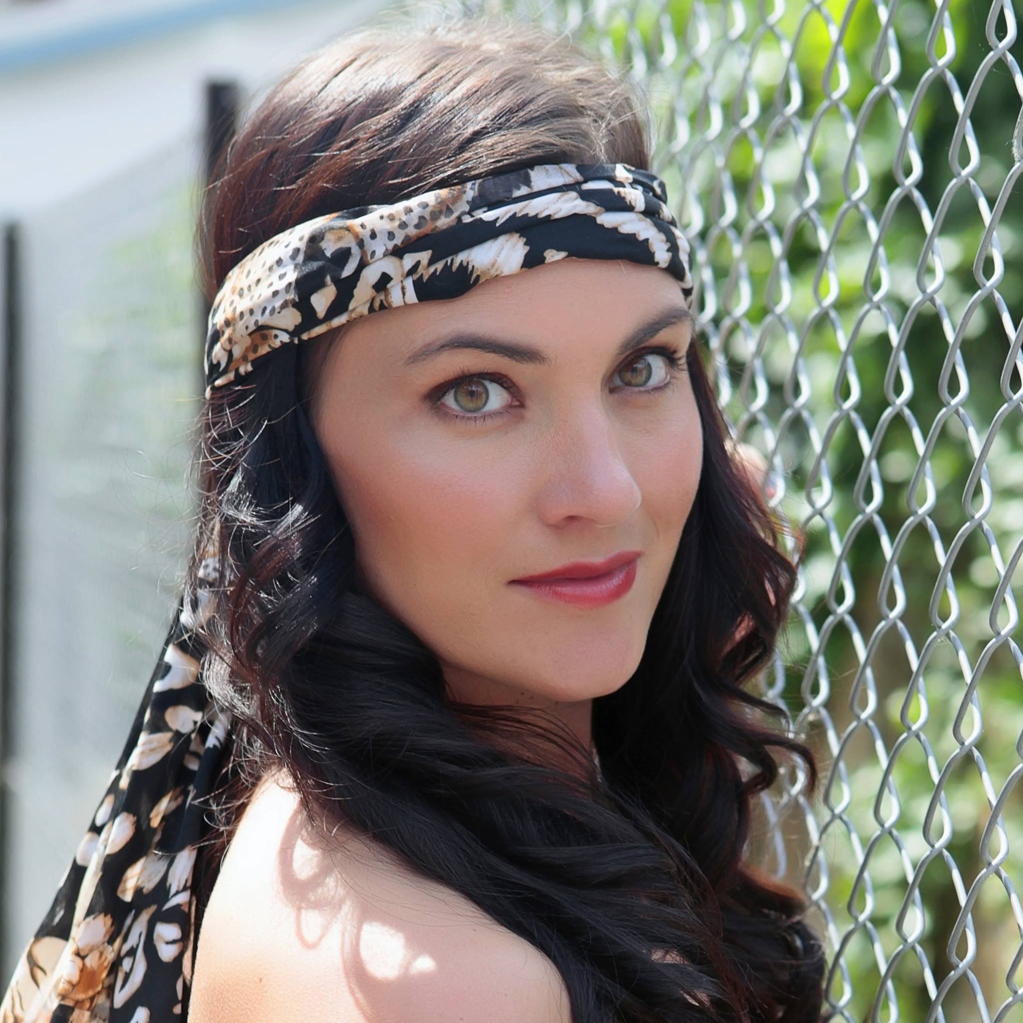 brunette girl with scarf wrapped around her head