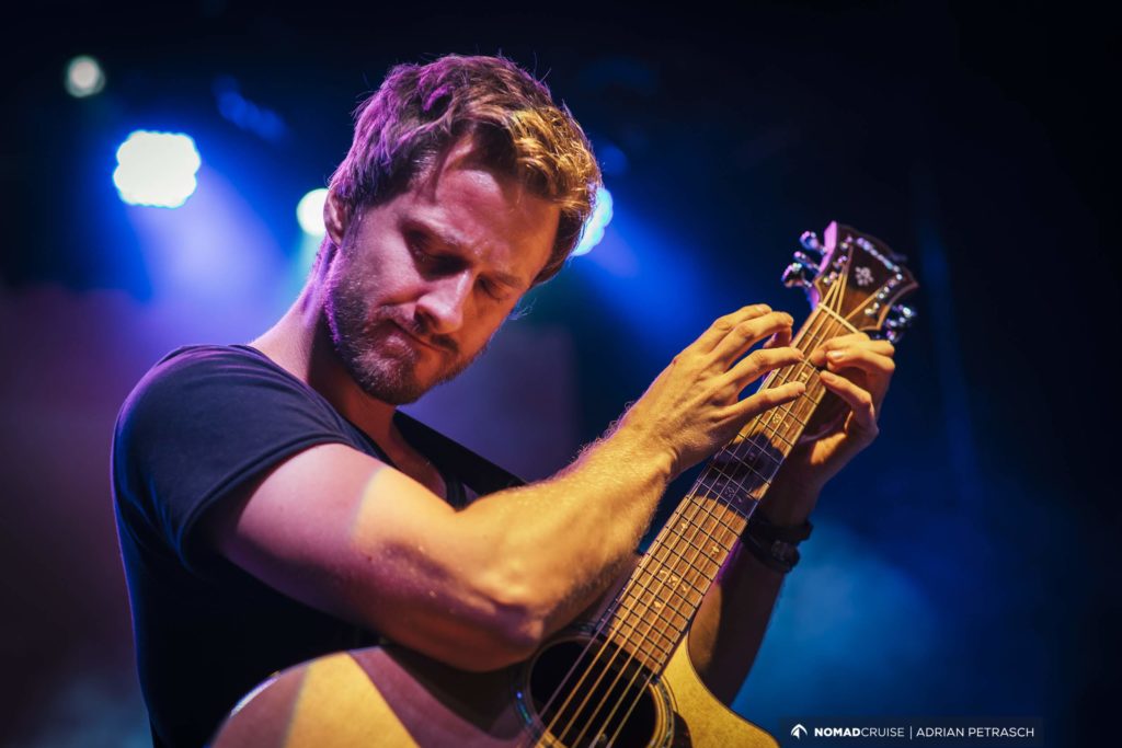 guy playing a guitar