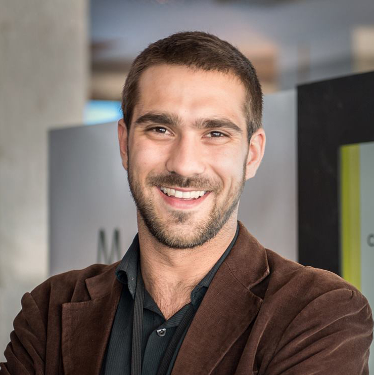 headshot of a man smiling