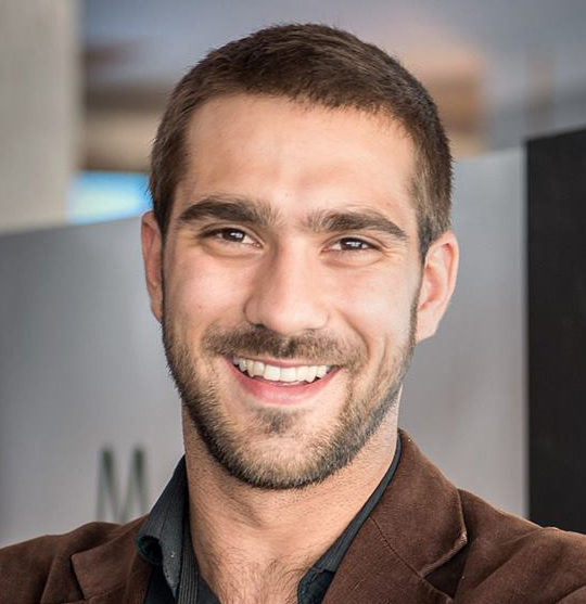 headshot of a man smiling