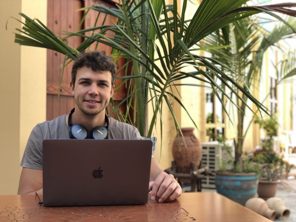 CEO Diego Bejarano Gerke seated with a laptop