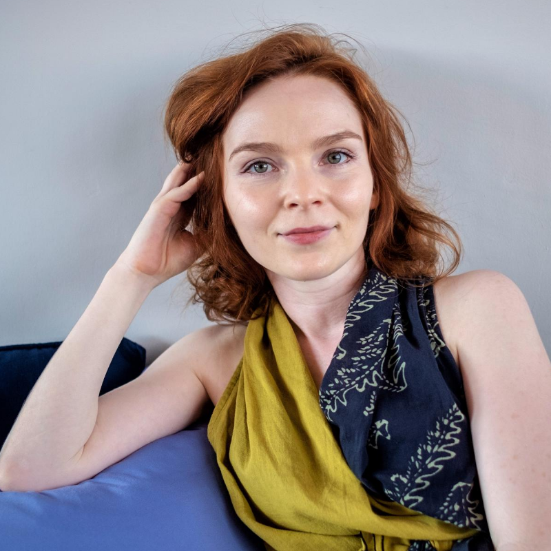 woman with a curly red hair