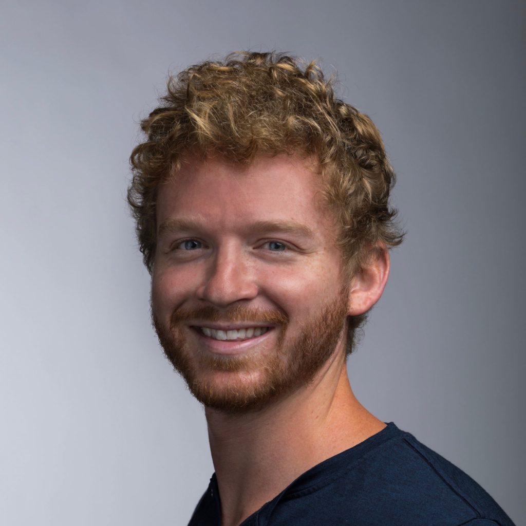 headshot of a man smiling