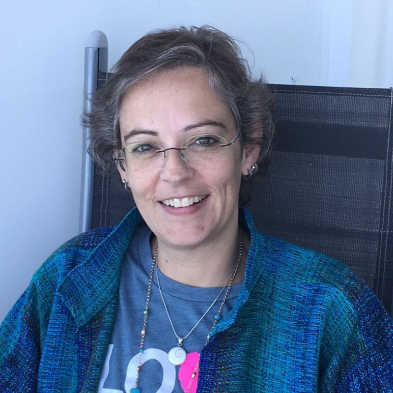 headshot of a woman with glasses