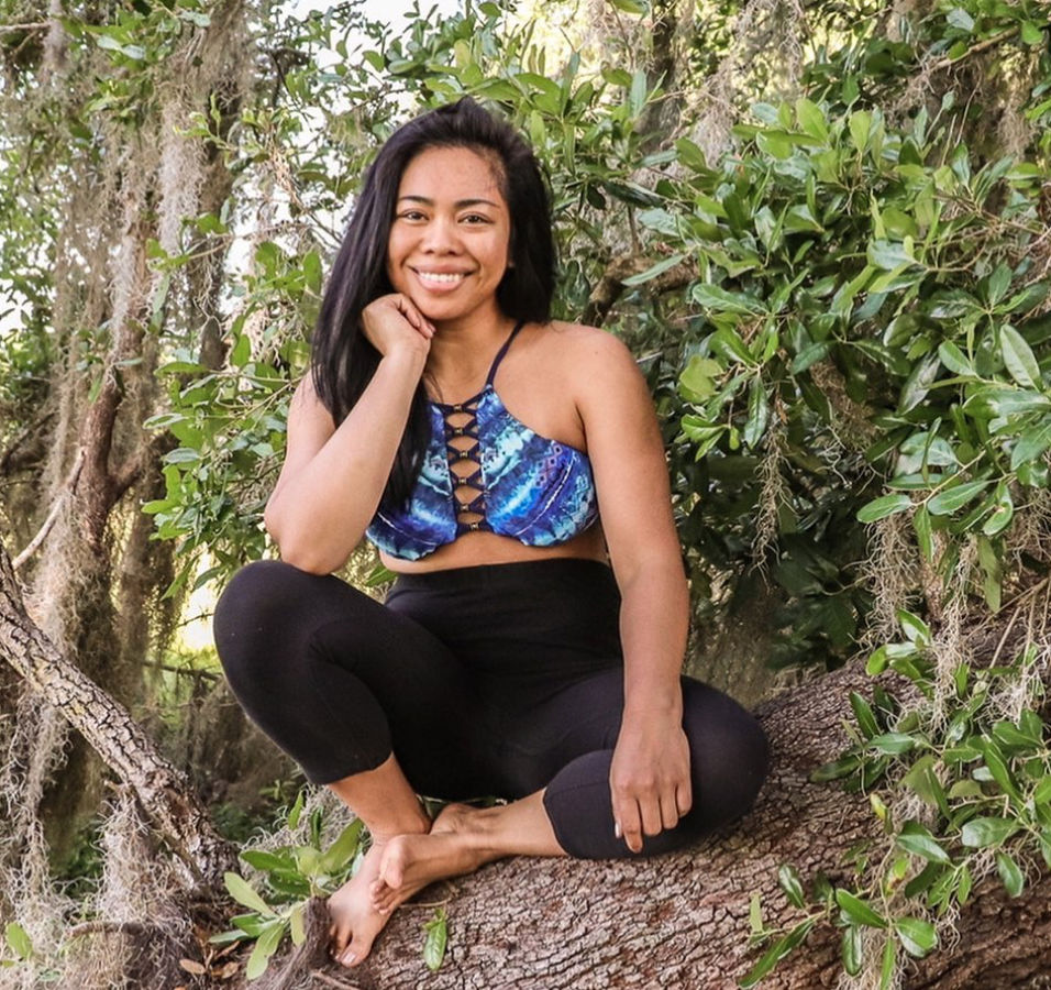 woman sitting on a tree