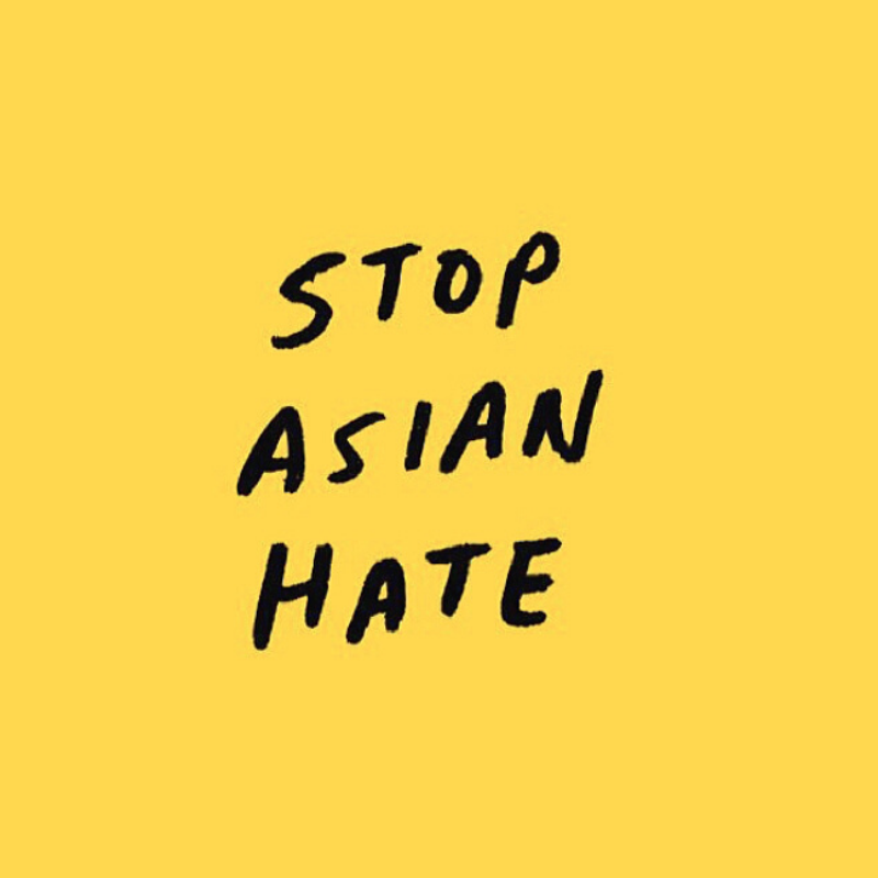 sign that reads stop asian hate