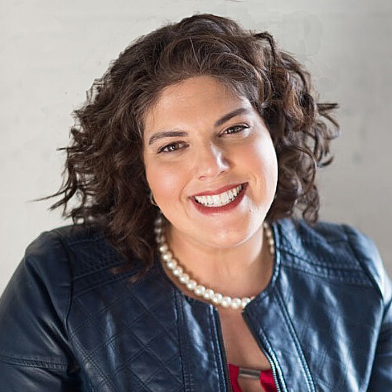 woman smiling wearing pearl necklace