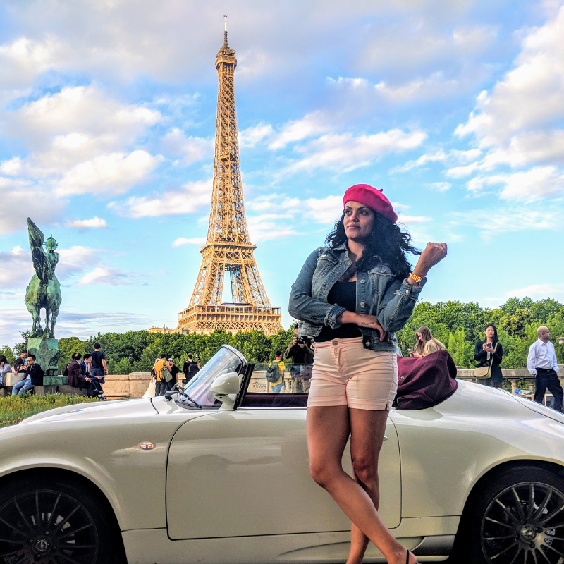 woman with a car and the eiffel tower