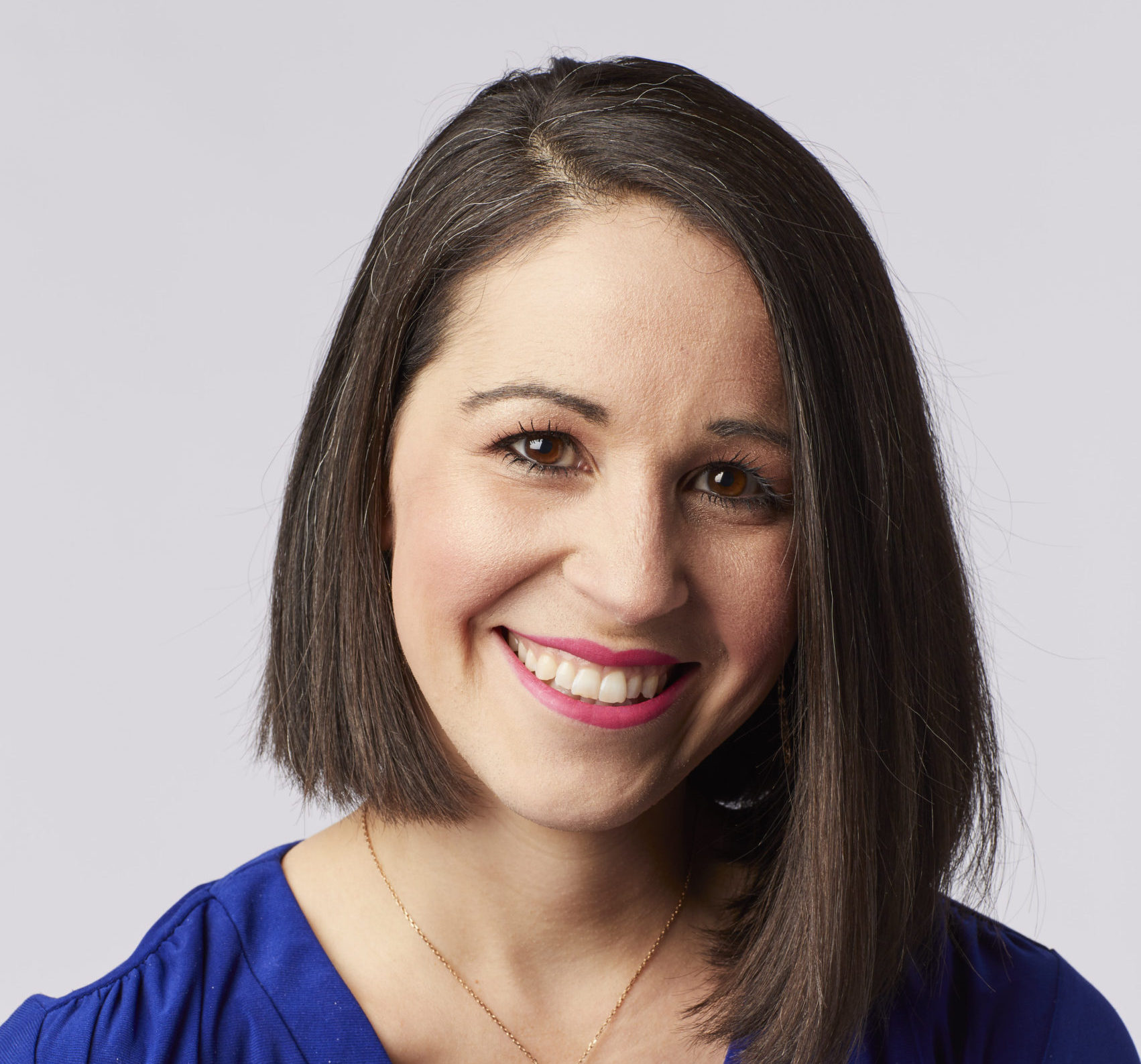 headshot photo of a woman smiling